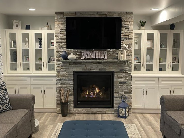Regency fireplace with a grey stone surround in a living room
