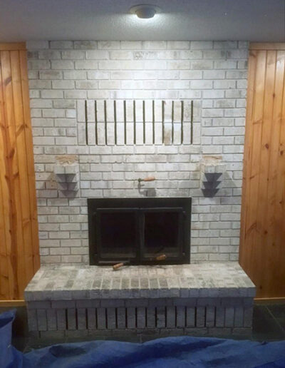 Grey brick surround prepped for remodel