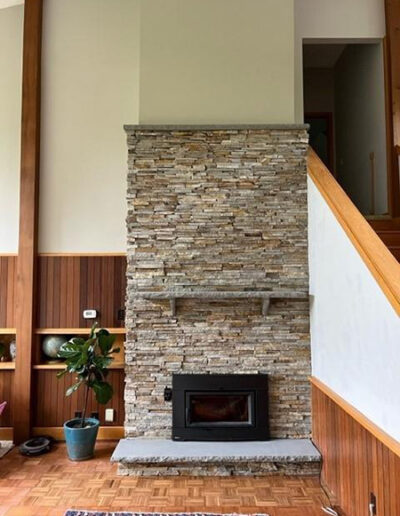 Stone surround with a black fireplace insert